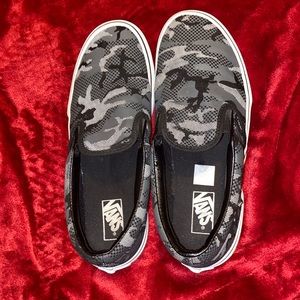 Black and grey camouflage slip on vans